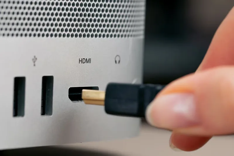 Plugging an HDMI streaming device into a TV to setup IPTV