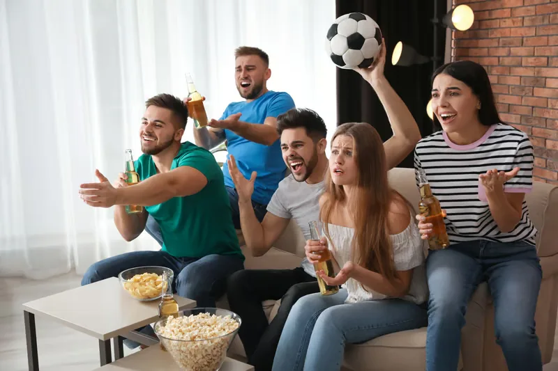 Friends watching live sports on the best IPTV USA service at home