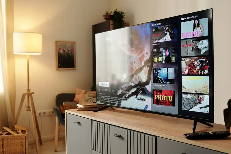 IPTV streaming interface on a Smart TV showing live channels and new releases