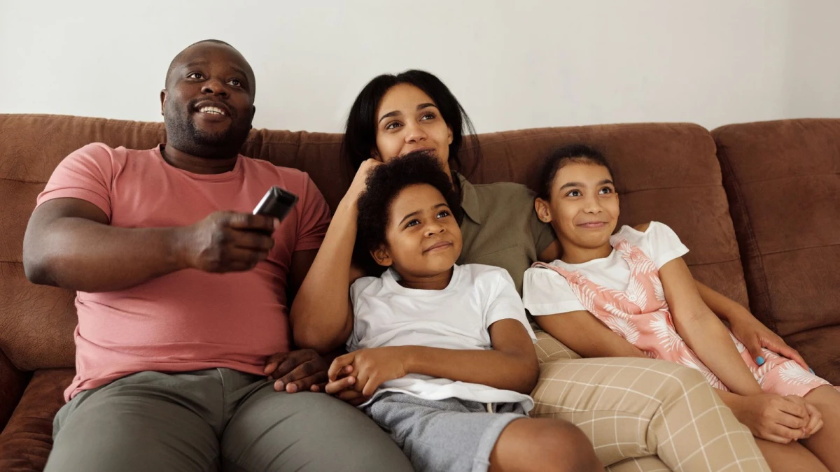 Family starting an IPTV trial on a smart TV in the living room